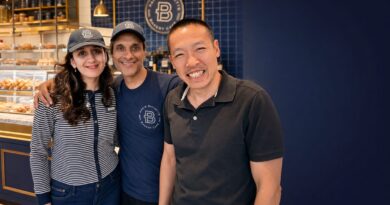 Editorial featured image showing Di Tran with the owner couple at Louisville’s first Paris Baguette in Kentucky, celebrating immigrant family entrepreneurship and small business support.