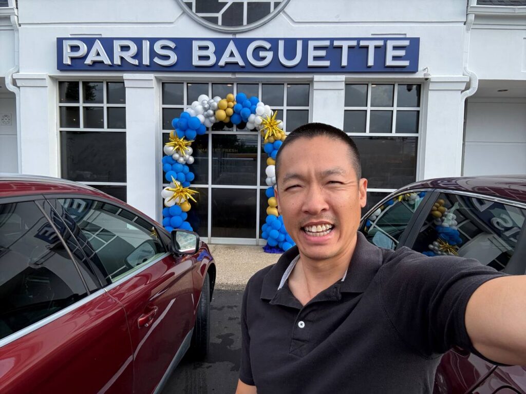 Exterior grand opening photo of Louisville’s first Paris Baguette in Kentucky with storefront balloons.