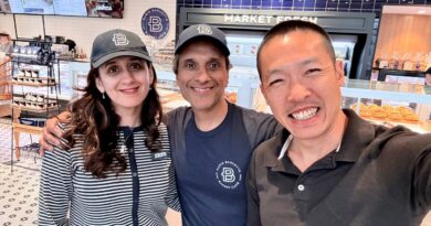 Di Tran posing with the owner couple inside Louisville’s first Paris Baguette in Kentucky.