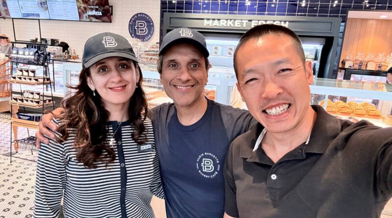 Di Tran posing with the owner couple inside Louisville’s first Paris Baguette in Kentucky.